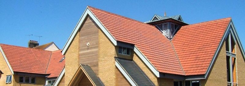 Natural red Double Roman tiles on a pitched roof