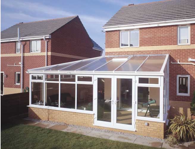 Conservatory with polycarbonate roofing sheets