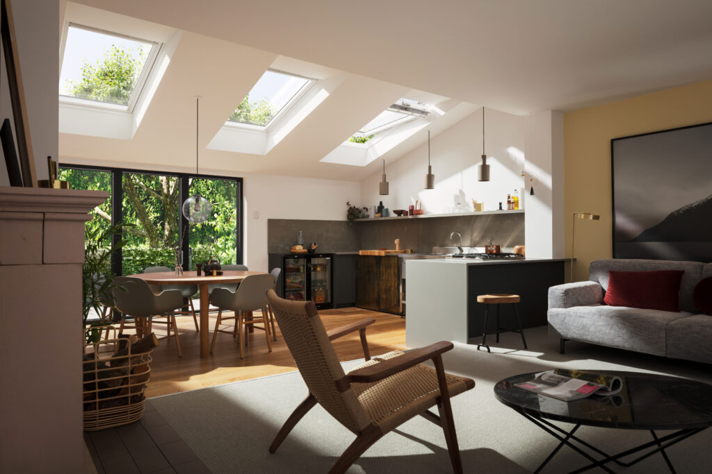 3 VELUX pitched roof windows installed in a modern kitchen extension with an open-plan dining space and lounge